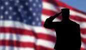 American-flag-and-saluting-soldier.webp