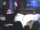 tom-oprah-arms.webp