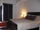 master bedroom with king bed-2.webp