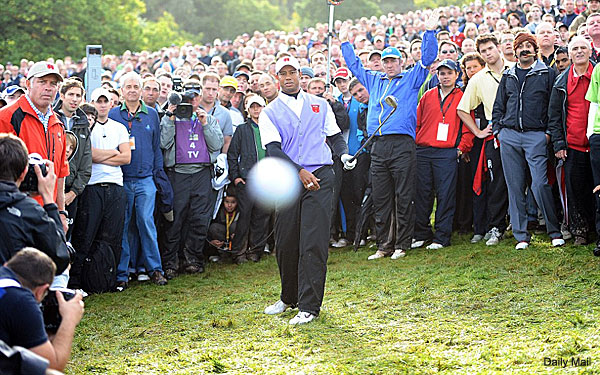 tiger-woods-ryder-cup-2011-hits-golf-ball-right-at-photographer.jpg