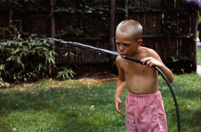 Boy_Drinking_Water_from_Garden_Hose.jpg