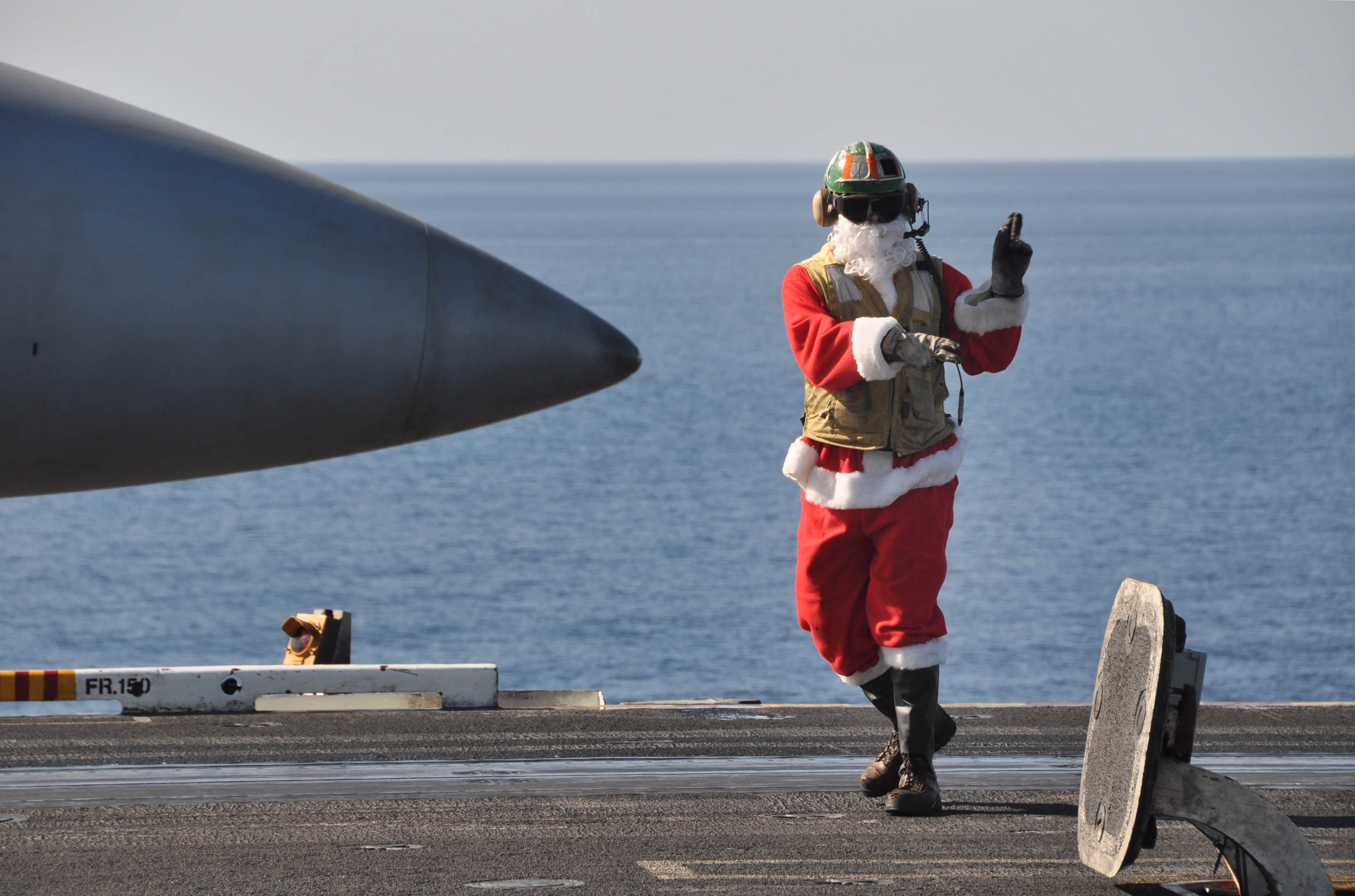 US_Navy_091225-N-8421M-103_t._Jon_Sunderland_dresses_in_a_Santa_suite_while_directing_aircraft_operations_aboard_the_aircraft_carrier_USS_Nimitz_(CVN_68)_Christmas_Day.jpg